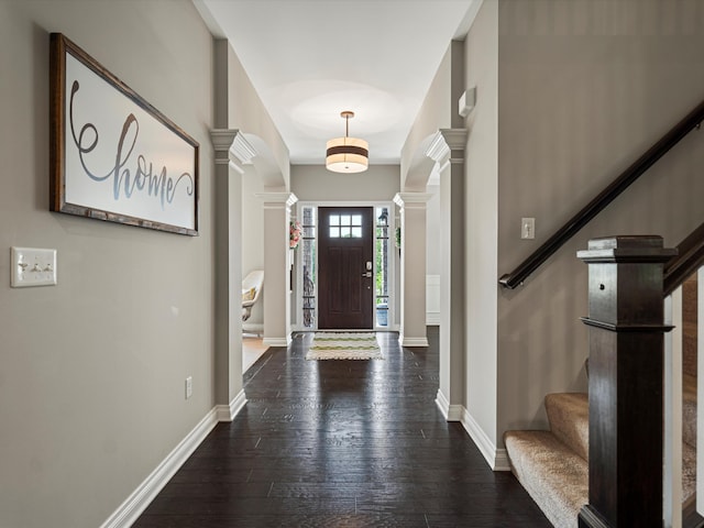 13531 Brampton Ct, Utica, MI 48315 - foyer entrance with decorative columns, stairway, and dark wood-style flooring