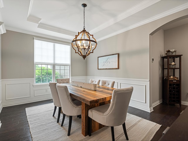 13531 Brampton Ct, Utica, MI 48315 - dining space featuring arched walkways, a chandelier, dark wood-type flooring, wainscoting, and crown molding