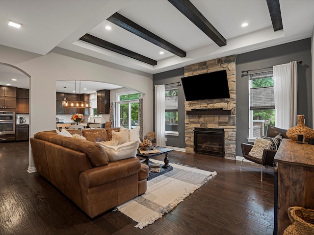 13531 Brampton Ct, Utica, MI 48315 - living room with arched walkways, plenty of natural light, dark wood-type flooring, beamed ceiling, and recessed lighting