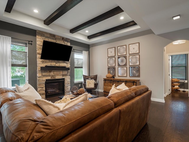 13531 Brampton Ct, Utica, MI 48315 - living area with a fireplace, dark wood-style floors, arched walkways, beam ceiling, and recessed lighting