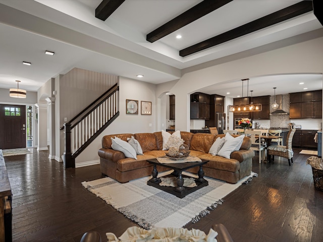 13531 Brampton Ct, Utica, MI 48315 - living room with arched walkways, dark wood-style floors, beamed ceiling, stairs, and recessed lighting