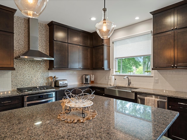 13531 Brampton Ct, Utica, MI 48315 - kitchen featuring wall chimney range hood, stainless steel appliances, dark brown cabinets, dark stone counters, and backsplash