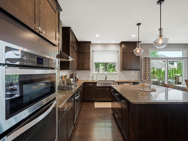 13531 Brampton Ct, Utica, MI 48315 - kitchen featuring stainless steel appliances, plenty of natural light, dark brown cabinets, dark wood-style floors, and recessed lighting