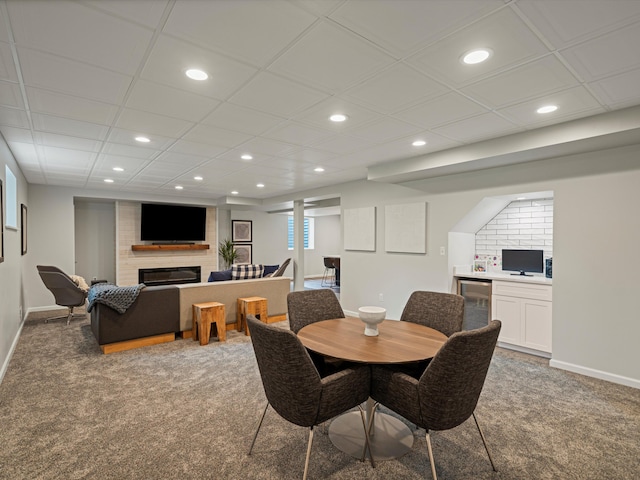 13531 Brampton Ct, Utica, MI 48315 - dining space featuring recessed lighting, light carpet, bar, a fireplace, and wine cooler