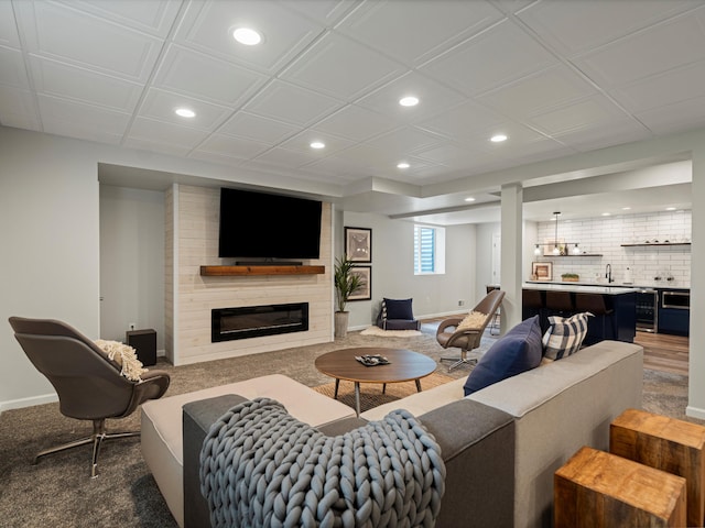 13531 Brampton Ct, Utica, MI 48315 - carpeted living room with recessed lighting and a large fireplace