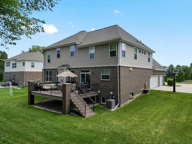 13531 Brampton Ct, Utica, MI 48315 - back of property featuring concrete driveway, a deck, a yard, and brick siding