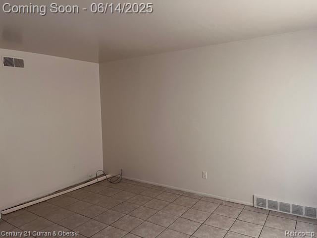 6423-25 Evergreen Rd, Detroit, MI 48228 - spare room featuring light tile patterned floors and baseboards