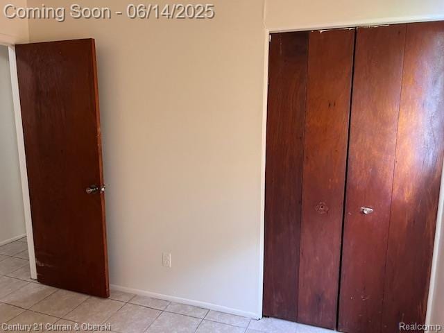 6423-25 Evergreen Rd, Detroit, MI 48228 - unfurnished bedroom featuring light tile patterned floors and a closet