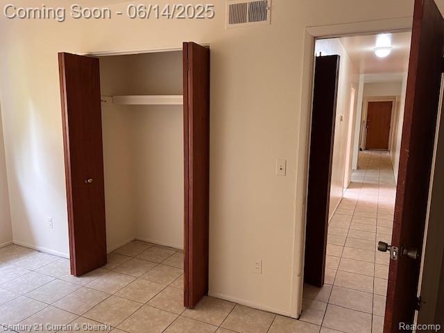 6423-25 Evergreen Rd, Detroit, MI 48228 - unfurnished bedroom with light tile patterned floors and a closet