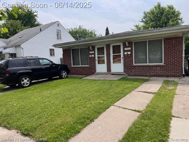 6423-25 Evergreen Rd, Detroit, MI 48228 - view of front of property featuring brick siding and a front yard