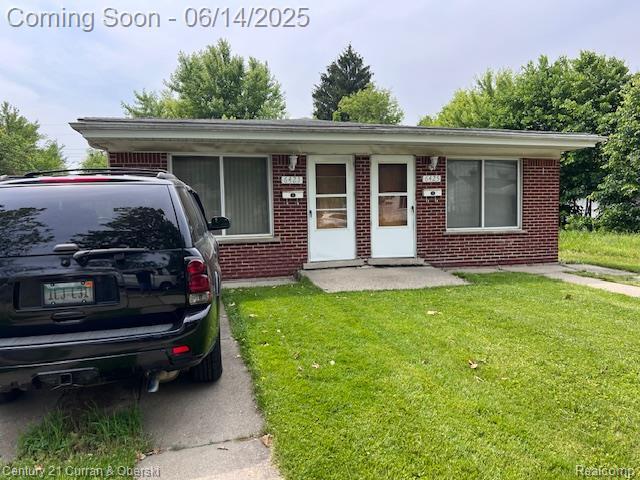 6423-25 Evergreen Rd, Detroit, MI 48228 - view of front of home with a front lawn and brick siding