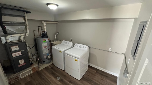 18615 Brohl St, Roseville, MI 48066 - laundry room featuring washer and dryer, water heater, and dark wood-style floors