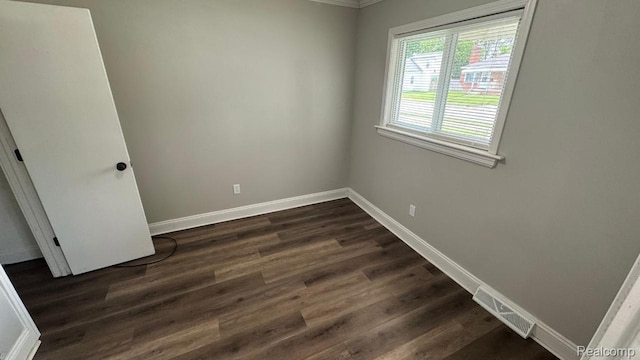 18615 Brohl St, Roseville, MI 48066 - spare room featuring dark wood finished floors and ornamental molding