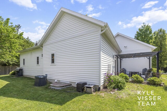 3 Woodward Ln SE, Grand Rapids, MI 49506 - view of home's exterior with a lawn and a cooling unit