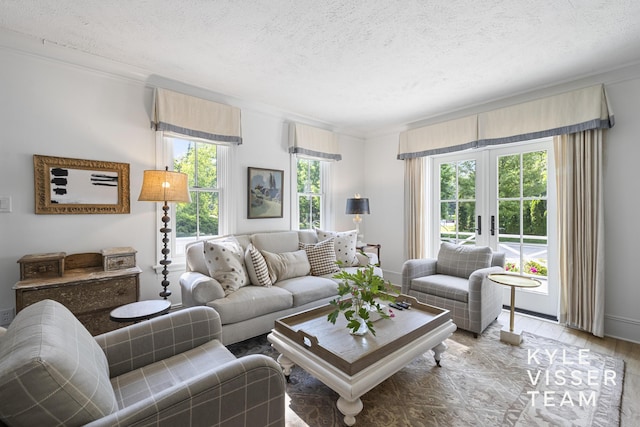 3 Woodward Ln SE, Grand Rapids, MI 49506 - living room featuring crown molding, a textured ceiling, french doors, and wood finished floors