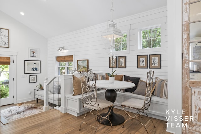 3 Woodward Ln SE, Grand Rapids, MI 49506 - dining space with breakfast area, wood finished floors, wood walls, recessed lighting, and high vaulted ceiling