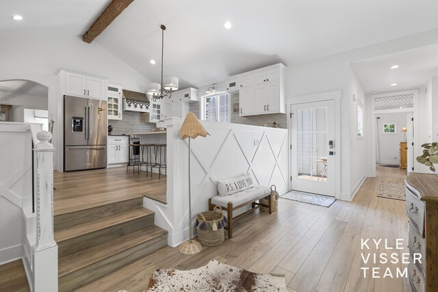 3 Woodward Ln SE, Grand Rapids, MI 49506 - entryway with light wood-style floors, arched walkways, healthy amount of natural light, a chandelier, and recessed lighting