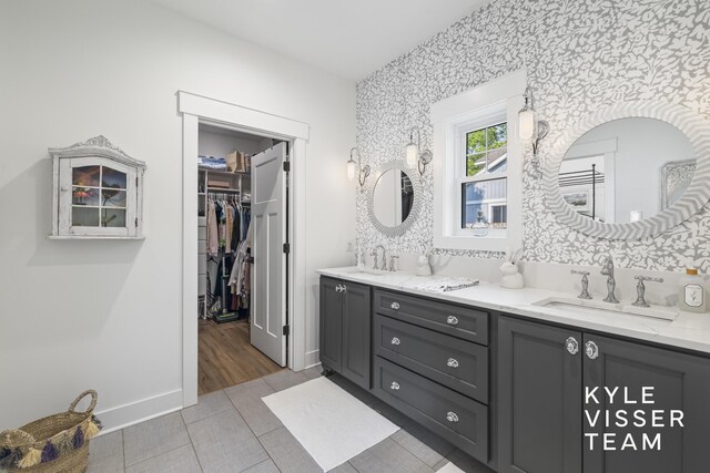 3 Woodward Ln SE, Grand Rapids, MI 49506 - bathroom featuring double vanity and a spacious closet