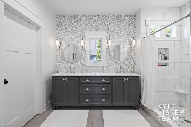 3 Woodward Ln SE, Grand Rapids, MI 49506 - full bath featuring tiled shower, tile patterned flooring, and double vanity