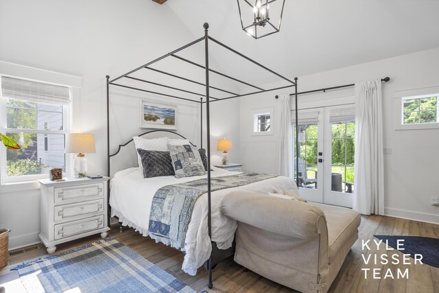 3 Woodward Ln SE, Grand Rapids, MI 49506 - bedroom featuring access to exterior, a chandelier, wood finished floors, lofted ceiling, and french doors