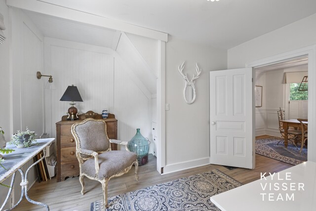 3 Woodward Ln SE, Grand Rapids, MI 49506 - sitting room featuring light wood-type flooring and a decorative wall