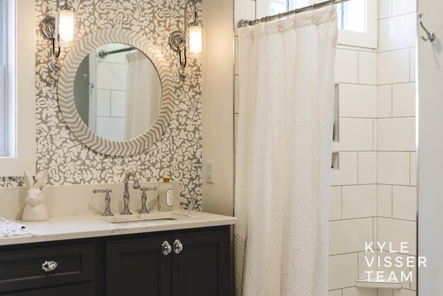 3 Woodward Ln SE, Grand Rapids, MI 49506 - bathroom with vanity and a shower with shower curtain