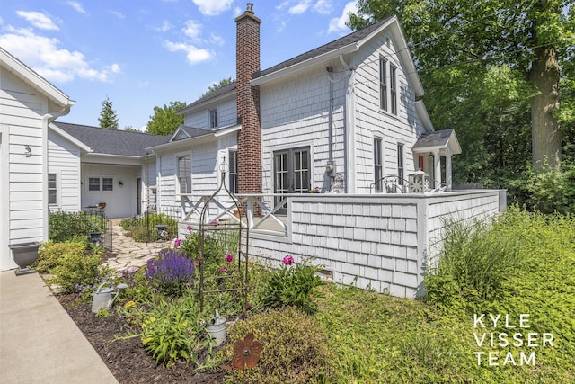 3 Woodward Ln SE, Grand Rapids, MI 49506 - view of side of property with a chimney