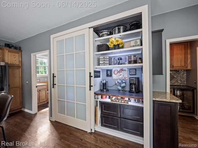 7235 Goldenrod Ct, Brighton, MI 48116 - bar area with dark wood finished floors, tasteful backsplash, and wine cooler