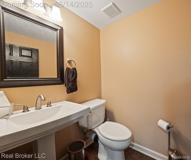 7235 Goldenrod Ct, Brighton, MI 48116 - bathroom featuring toilet and baseboards