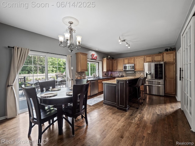 7235 Goldenrod Ct, Brighton, MI 48116 - dining area featuring a chandelier and dark wood-style flooring