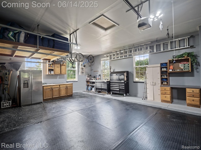 7235 Goldenrod Ct, Brighton, MI 48116 - garage with stainless steel refrigerator with ice dispenser and a garage door opener