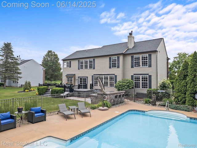 7235 Goldenrod Ct, Brighton, MI 48116 - rear view of house with a patio and a chimney