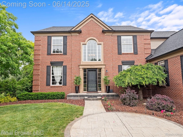 7235 Goldenrod Ct, Brighton, MI 48116 - colonial inspired home with a front lawn and brick siding