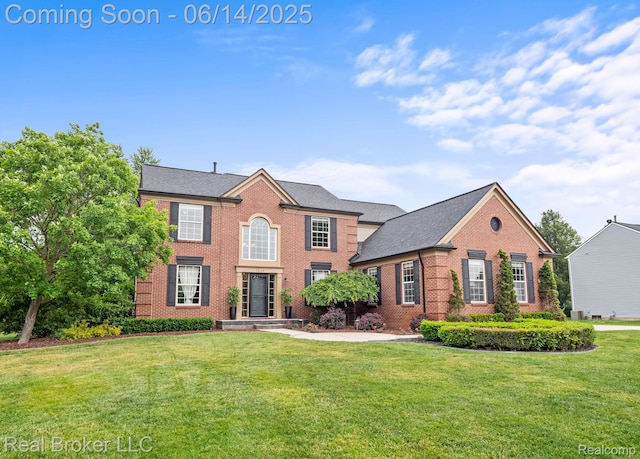7235 Goldenrod Ct, Brighton, MI 48116 - view of front of house featuring brick siding and a front yard