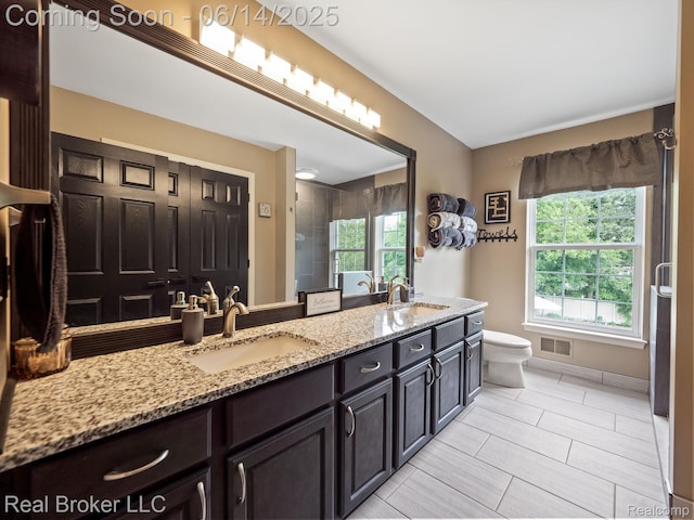 7235 Goldenrod Ct, Brighton, MI 48116 - bathroom with double vanity, plenty of natural light, a shower, and tile patterned flooring