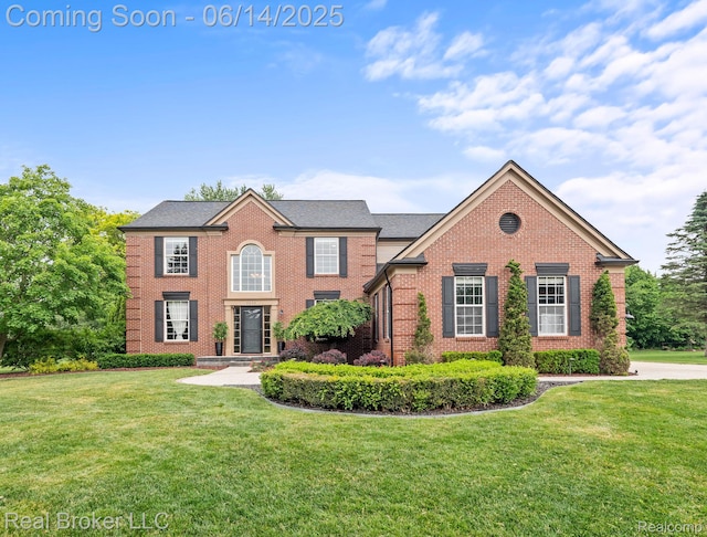 7235 Goldenrod Ct, Brighton, MI 48116 - view of front of home featuring brick siding and a front yard