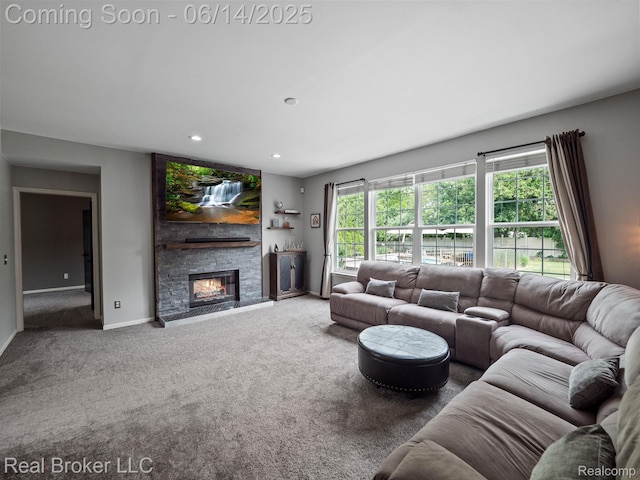 7235 Goldenrod Ct, Brighton, MI 48116 - carpeted living area with healthy amount of natural light, a fireplace, and recessed lighting