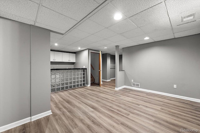 2696 Cedar Key Dr, Lake Orion, MI 48360 - finished basement with a bar, light wood-style flooring, a drop ceiling, and recessed lighting