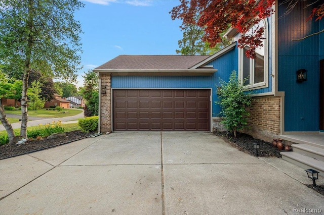 2696 Cedar Key Dr, Lake Orion, MI 48360 - garage featuring concrete driveway
