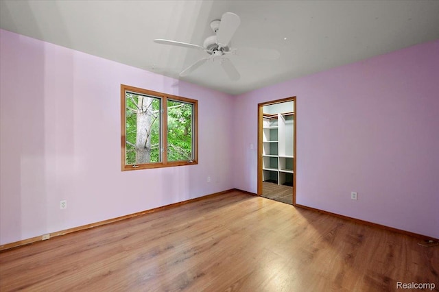 2696 Cedar Key Dr, Lake Orion, MI 48360 - empty room with light wood-style flooring and a ceiling fan