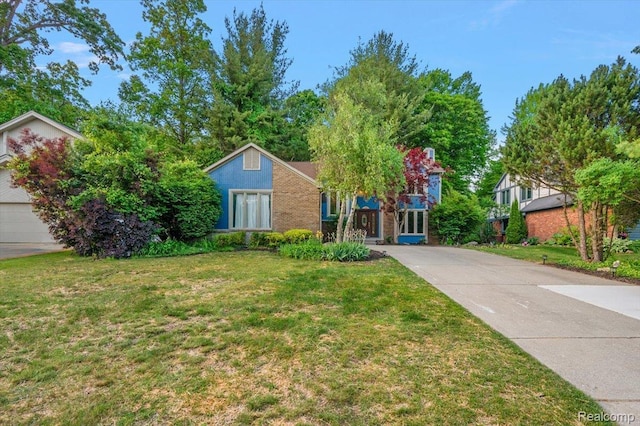 2696 Cedar Key Dr, Lake Orion, MI 48360 - view of front facade featuring a front yard and brick siding