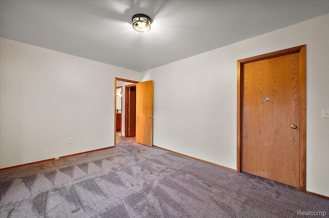 2696 Cedar Key Dr, Lake Orion, MI 48360 - carpeted empty room with baseboards