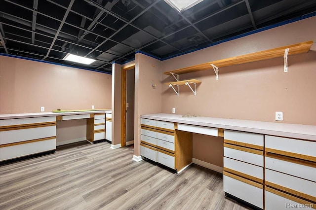 2696 Cedar Key Dr, Lake Orion, MI 48360 - walk in closet with built in study area and light wood-style flooring
