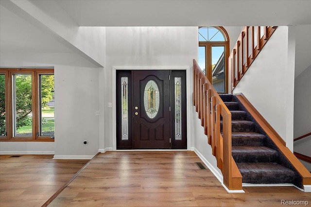 2696 Cedar Key Dr, Lake Orion, MI 48360 - entrance foyer featuring plenty of natural light, wood finished floors, and stairway