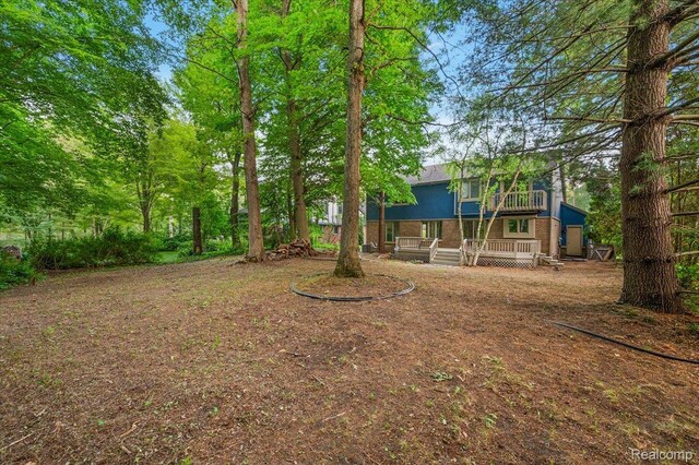 2696 Cedar Key Dr, Lake Orion, MI 48360 - view of yard with a wooden deck