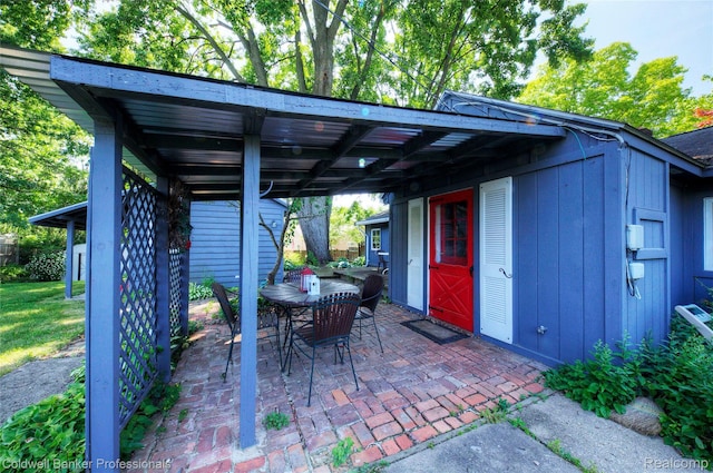 290 Florawood Blvd, Waterford, MI 48327 - view of patio with outdoor dining space and a carport