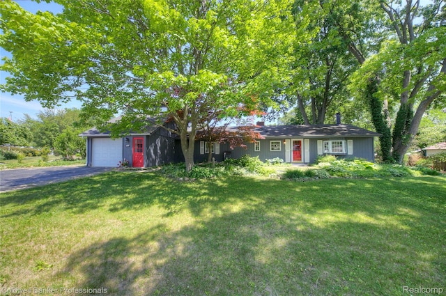 290 Florawood Blvd, Waterford, MI 48327 - ranch-style home featuring a front lawn, asphalt driveway, an attached garage, and a chimney