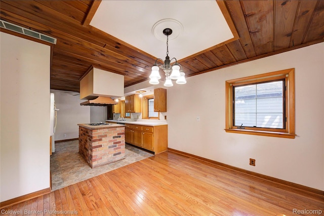 290 Florawood Blvd, Waterford, MI 48327 - kitchen with light wood finished floors, wood ceiling, custom range hood, brown cabinets, and white gas cooktop