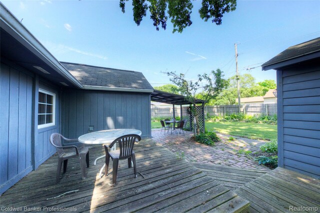 290 Florawood Blvd, Waterford, MI 48327 - deck featuring outdoor dining area and a fenced backyard