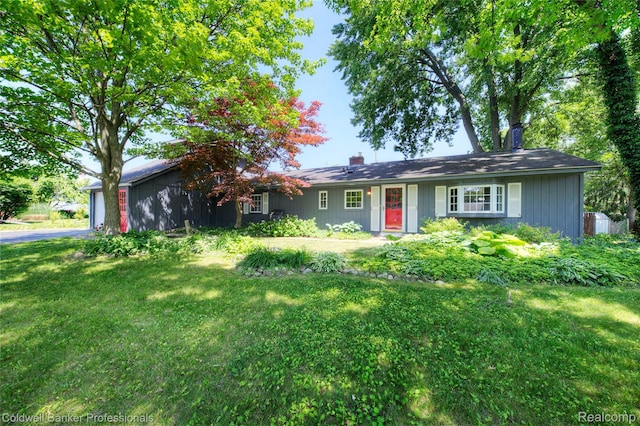 290 Florawood Blvd, Waterford, MI 48327 - single story home featuring a front lawn, asphalt driveway, and a garage